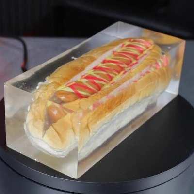 A hot dog in clear resin