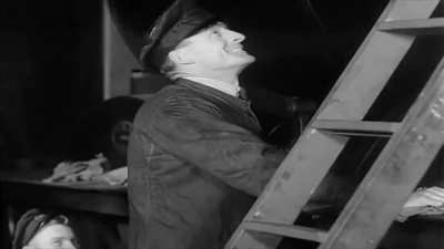 Having the new guy clean out a steam locomotive chimney from a 1939 vintage rail film