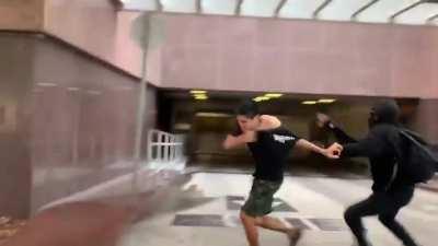 At the Wi Spa protest in Los Angeles, a lone young man gets his sign ripped up by an antifa. A mob of antifa then assaults him to the ground & kicks him after he got out pepper spray.