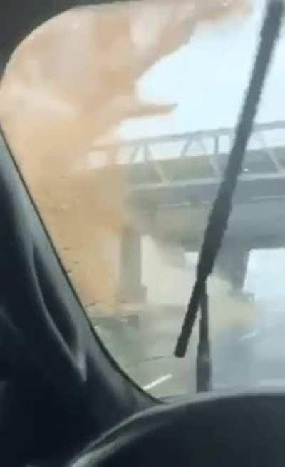 Truck fail hitting a pedestrian overpass