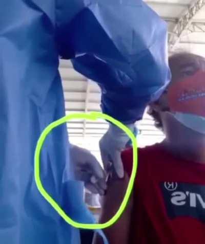 Pretending to inject vaccine