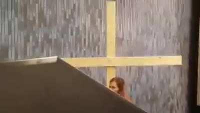 By carrying huge cross on a lift.