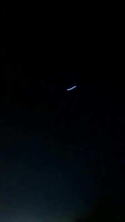 Unidentified flying object observed in Iran last week: first segment shows excited people noticing the object; second part shows Iranian military air defense systems shooting towards the object. Object shows no reaction to the shooting, eventually disappe