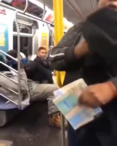 Man beats the shit out of his girlfriend on the subway. She manages to maintain a calm demeanor.