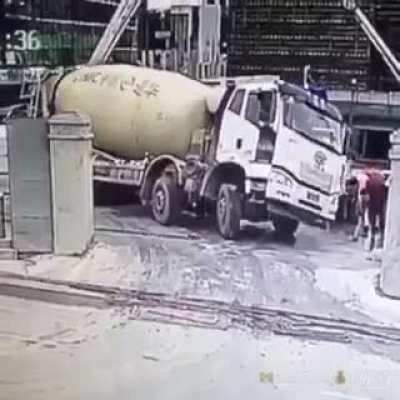 Backing up a huge cement truck is precision work