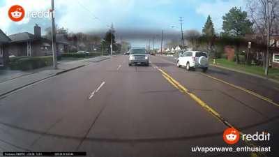 Ontario Canada car hits another car then a bus stop with a person waiting inside almost hit too