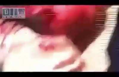 A man or Angel lift a body with one hand in Syria back in 2011 *Strong Language* in Arabic