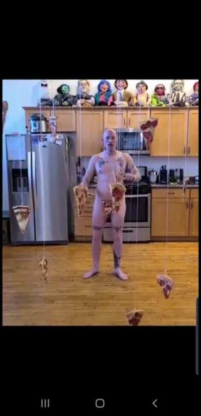 Near naked man & floating pizza