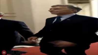 Wide Putin and Macri walking down the casa rosada