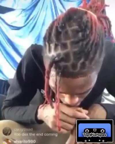 Looks like he’s smoking a finger.