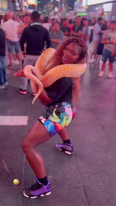 Terralicia holding a snake in New York City.