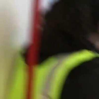 Mallgoers loudly react to man leaping off railing.