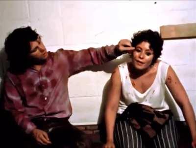 Jim Morrison consoling a fan backstage after she was whacked by a chair when a riot broke out at a Doors concert in 1968. 