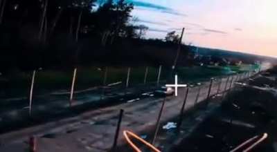 Russian fibre optic drone strikes Ukrainian vehicle (Music added by the source)
