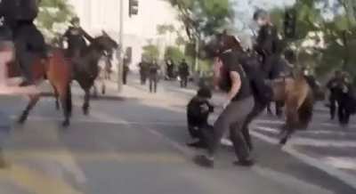 More officers attempt to incircle and trample LA protestor