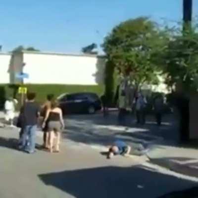 Guy drags a helpless person across the street then gets what's coming to him