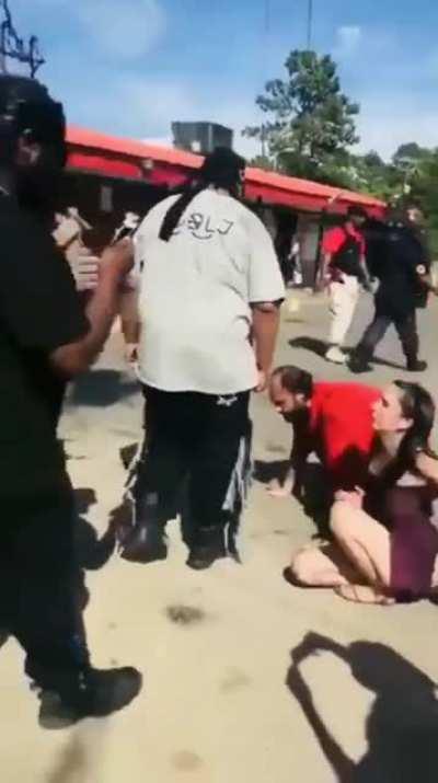 White people kissing the feet of black people