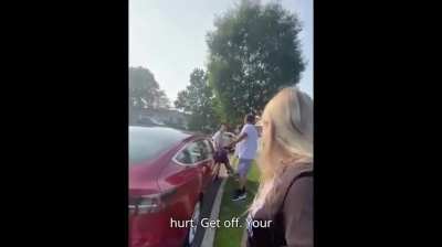 Wife tries to reason with off duty cop sitting on her man's car.. and this is what he does