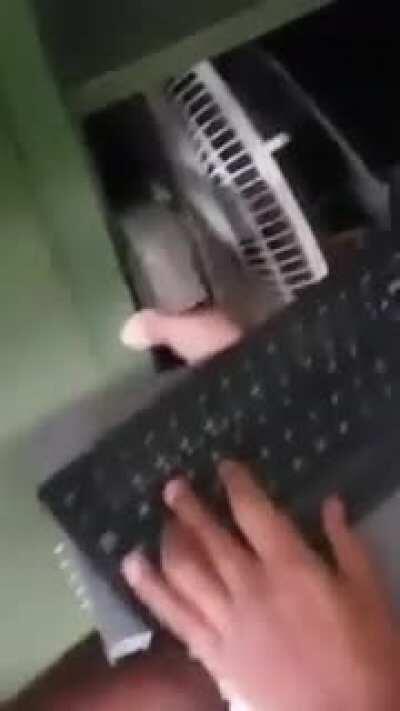 This soldier set up a gamer PC inside the army closet. And yes, he is using a fan as a cooler.