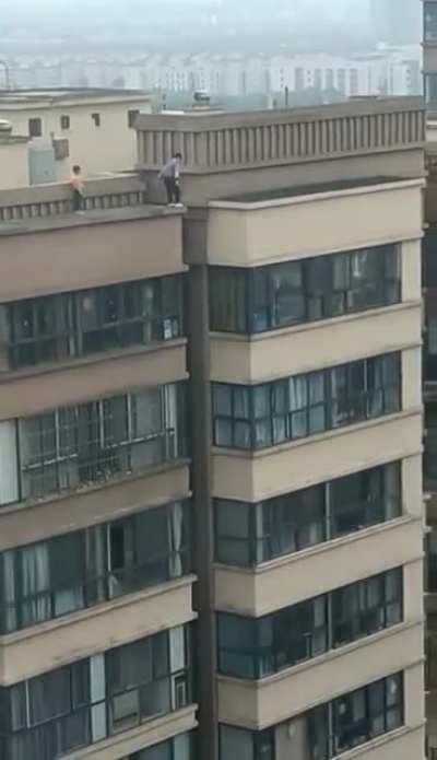 Kids jumping across high rise buildings