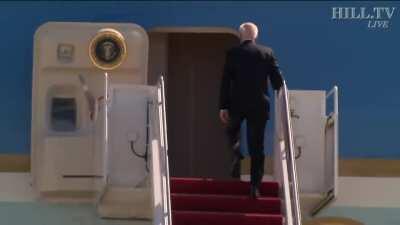 Biden falls walking up steps to AF1