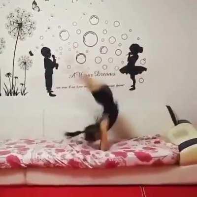 Young Gymnast does over 80 backflips in a row...in place.