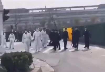Chinese police beating up protesting Foxconn workers if they are alone