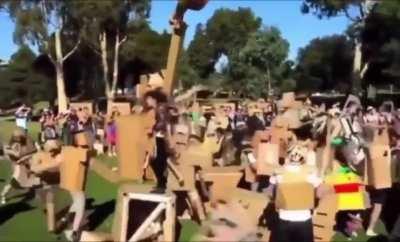 Each year in an Australian park, hundreds of people bring their handmade cardboard creations to battle in a giant cardboard war known as 