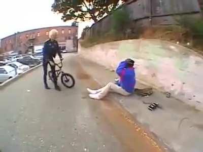 Cocky douche hits hobo in the head with a bike then tries to make it up with 10 bucks