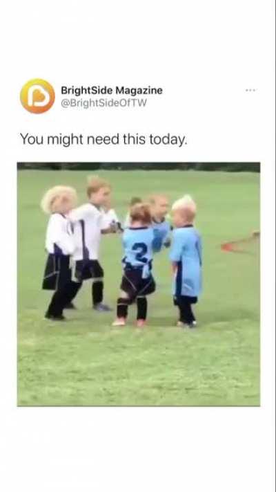 Girl gets hit and starts crying during a soccer match. Another girl immediately starts comforting her.