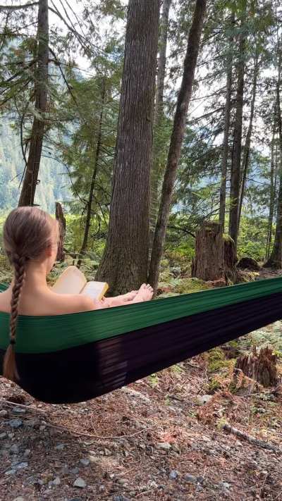 Reading naked in a hammock 
