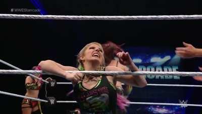 Alexa screams in pain as Kairi yanks on her hair and double stomp on her stomach!