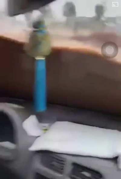 Man stuck in his car in China floods