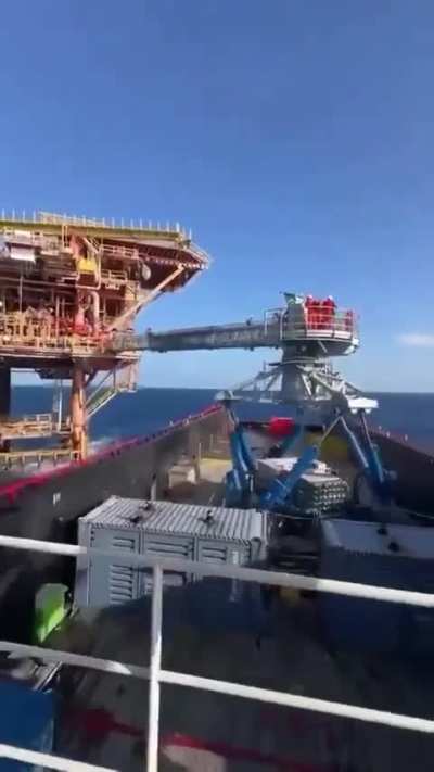 Video of a Stewart platform allowing the crew to safely transfer from an oil rig to a ship. The footage is accelerated to show the effect of the system better.