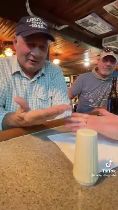 Older gentleman at a bar is super smooth with a magic trick