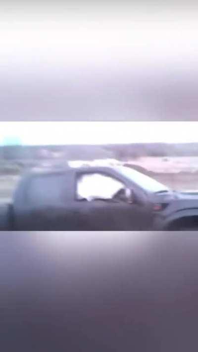 WCGW driving a pickup truck over a dirt bike ramp