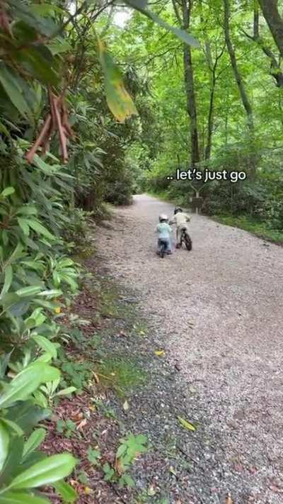 Taking his little sister on her first bike ride.