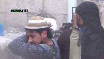 Opposition fighters struggle with a DShK while engaging Syrian Army positions near Omari Mosque, Daraa - 2013