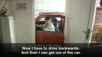Old man parks his car into a very small garage