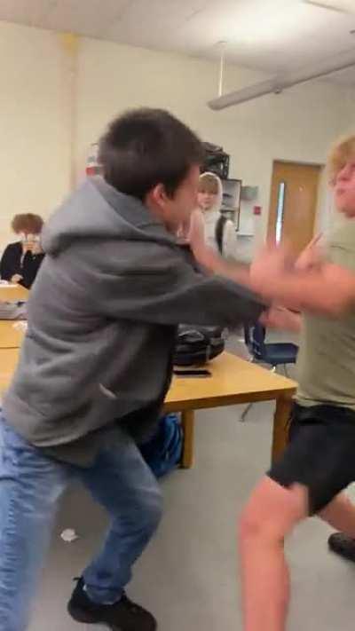 Fight at my school I was recording btw backstory is dude in grey was talking shit dude in green beat him for it and green got hate cuz Greg was sped