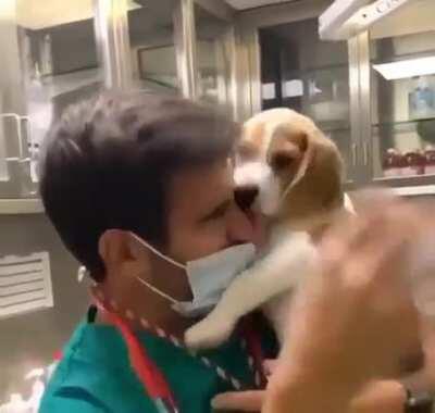 Medical professional having to deal with an unruly patient trying to take off their mask