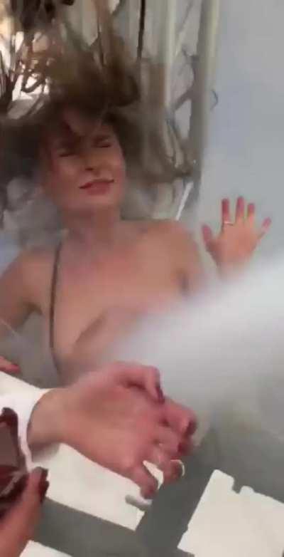 Girl's shirt blown down, boobs exposed