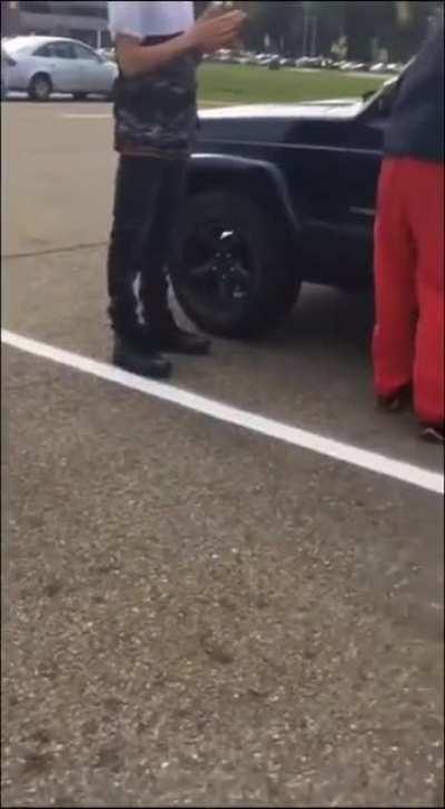 Racist bully hides in car like a coward