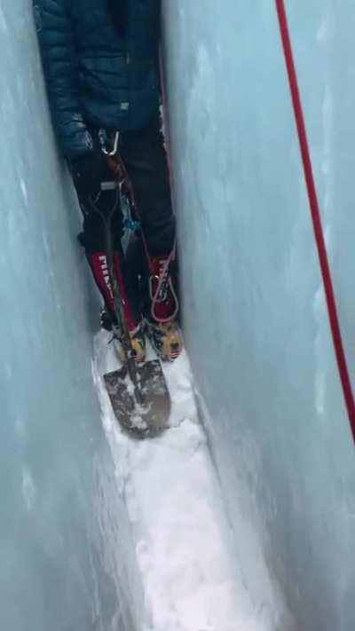 Sherpas rescuing guy from crevasse on Mt. Everest
