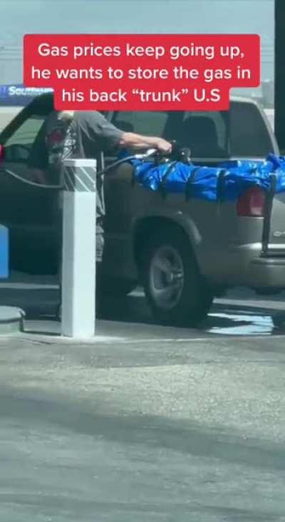 Guy fills back of pickup with gasoline