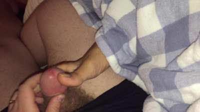 Covering her sleeping toes in cum