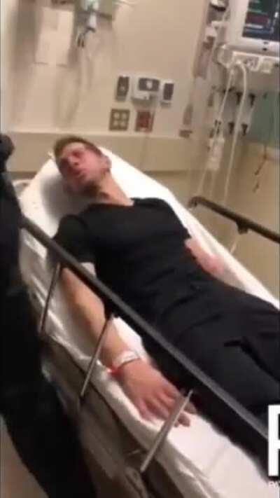 Two cops film themselves assaulting suicidal man in hospital bed.