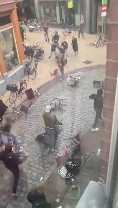 Men having a brawl in the street