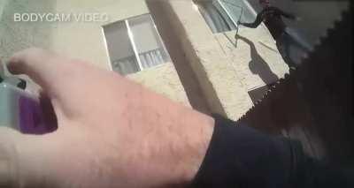 Police bodycam captures a young man saving 2 children from a burning apartment.