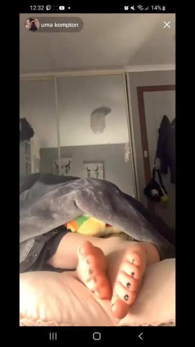 more of her rubbing her feet